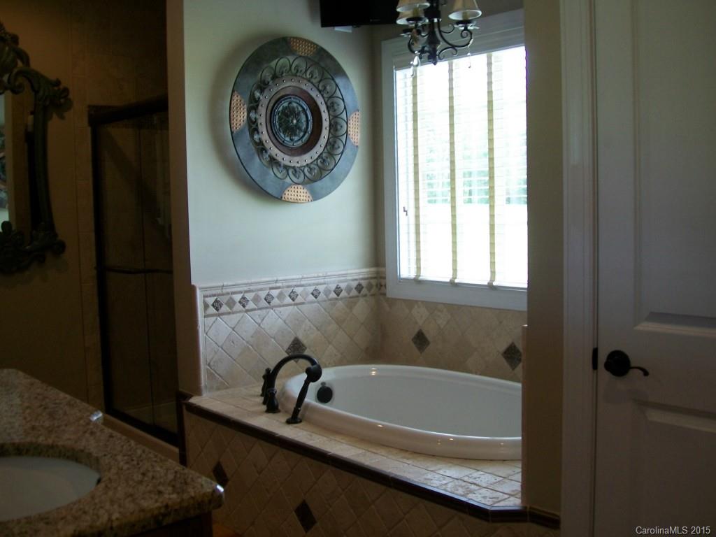 1707 Requa Road Cherryville, NC 28021 - Photo 18 of 24 a bathroom with a tub and a window