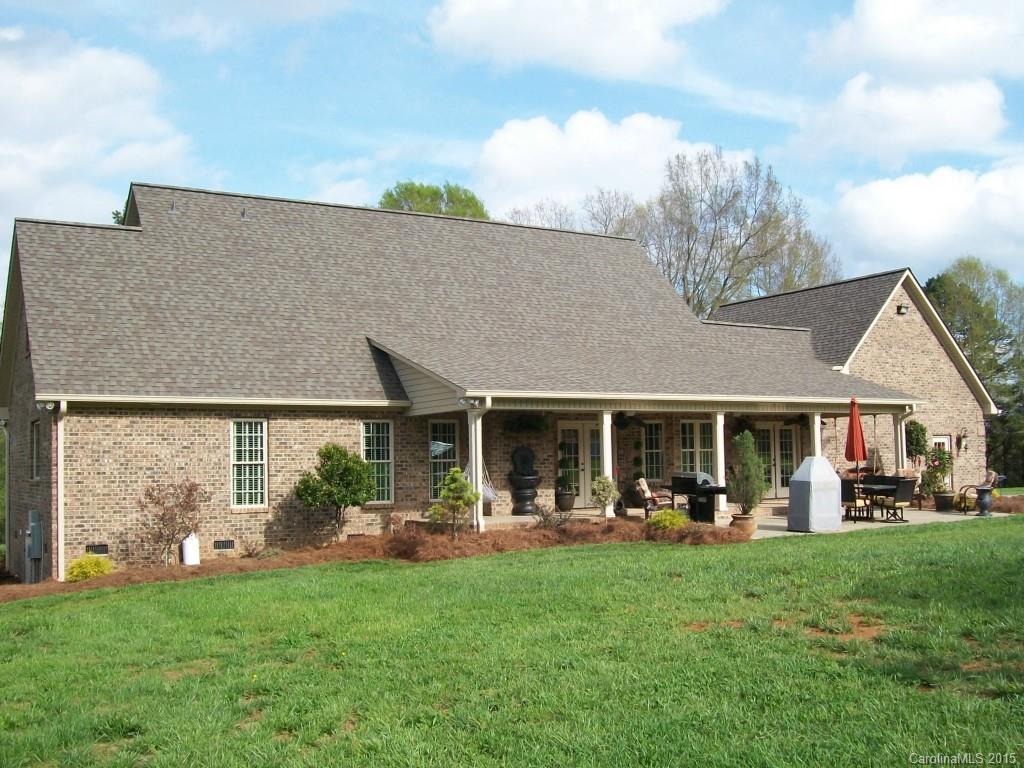 1707 Requa Road Cherryville, NC 28021 - Photo 21 of 24 a front view of a house with a garden and plants