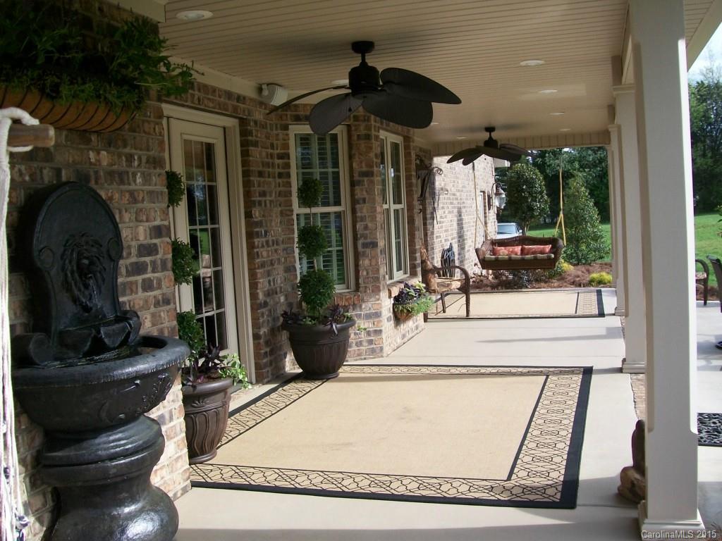 1707 Requa Road Cherryville, NC 28021 - Photo 22 of 24 a living room with fireplace furniture and a potted plant