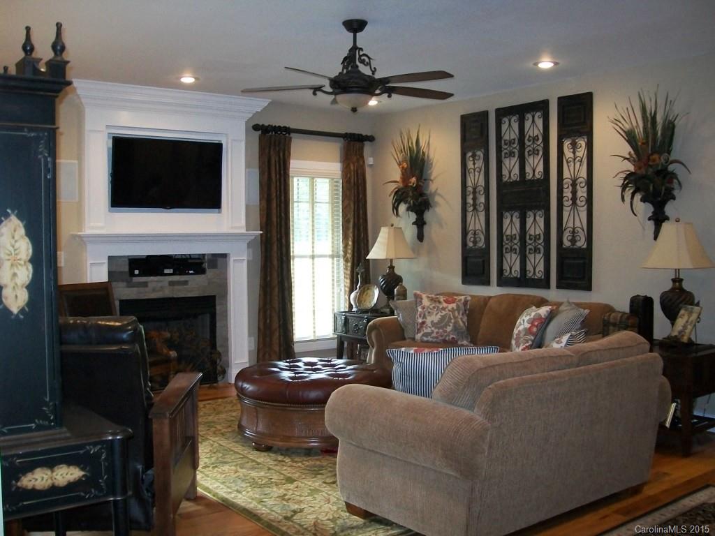 1707 Requa Road Cherryville, NC 28021 - Photo 7 of 24 a living room with fireplace furniture and a flat screen tv