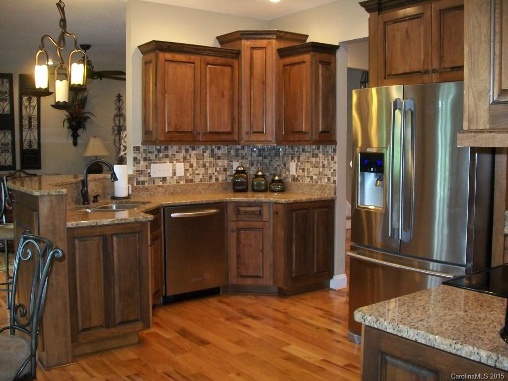 1707 Requa Road Cherryville, NC 28021 - Photo 10 of 24 a kitchen with stainless steel appliances granite countertop a refrigerator a sink and a stove