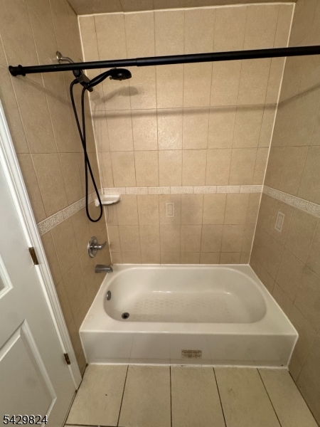 83 Broadway Elizabeth Port, NJ 07206 - Photo 4 of 10 a bath tub sitting next to a shower