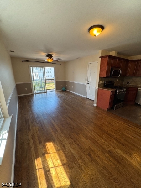 83 Broadway Elizabeth Port, NJ 07206 - Photo 7 of 10 an entryway with wooden floor
