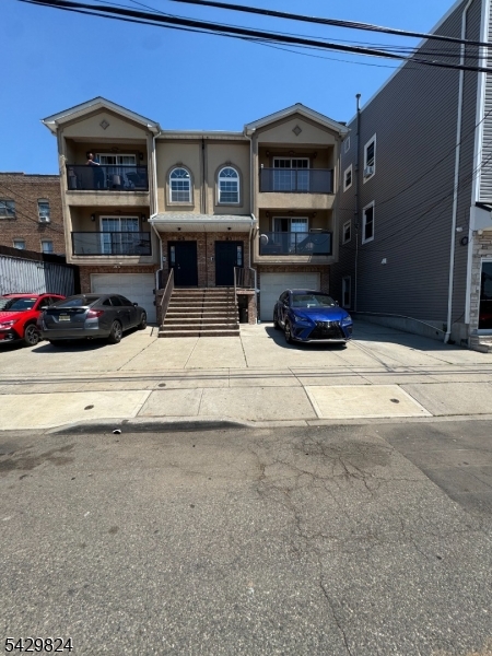 83 Broadway Elizabeth Port, NJ 07206 - Photo 9 of 10 a view of a car park in front of house