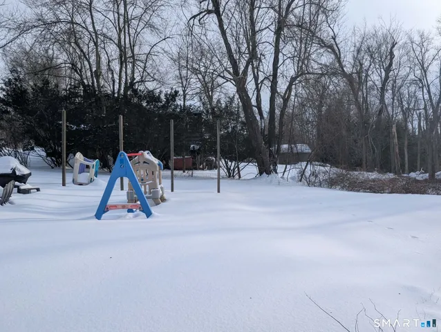 a view of park with a slide and swing