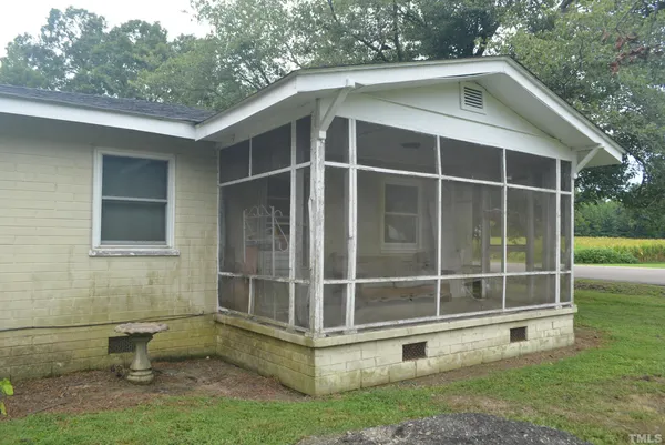 a view of backyard with cabin
