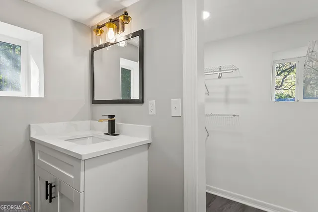 a bathroom with a sink and a mirror