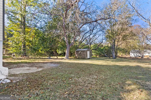 a view of a yard and a house
