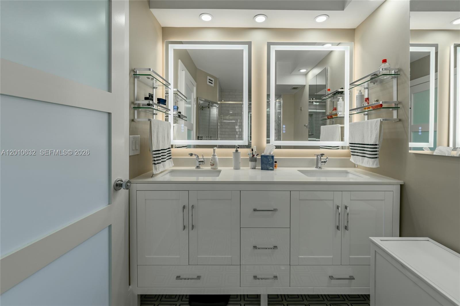 2639 North Riverside Drive, Unit 501 Pompano Beach, FL 33062 - Photo 19 of 39 a bathroom with a sink and a mirror