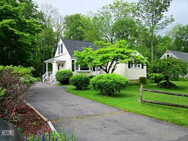 34 Winslow Road Trumbull, CT 06611 - Photo 1 of 1 a front view of a house with a yard and a garage