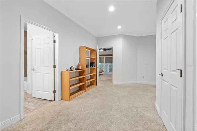 an empty room with closet and cabinet