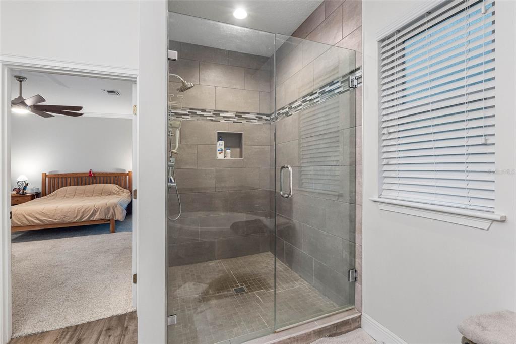 763 Date Palm Lane St. Petersburg, FL 33707 - Photo 19 of 34 a bathroom with a shower and a window