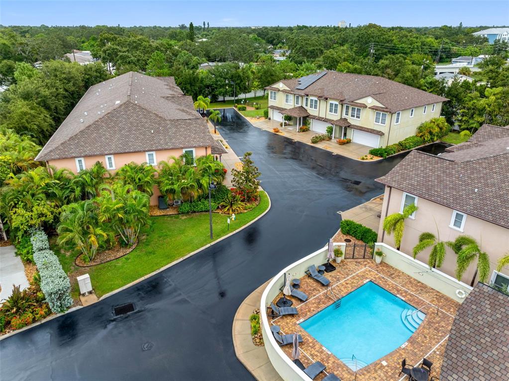 763 Date Palm Lane St. Petersburg, FL 33707 - Photo 31 of 34 a view of a swimming pool with a patio