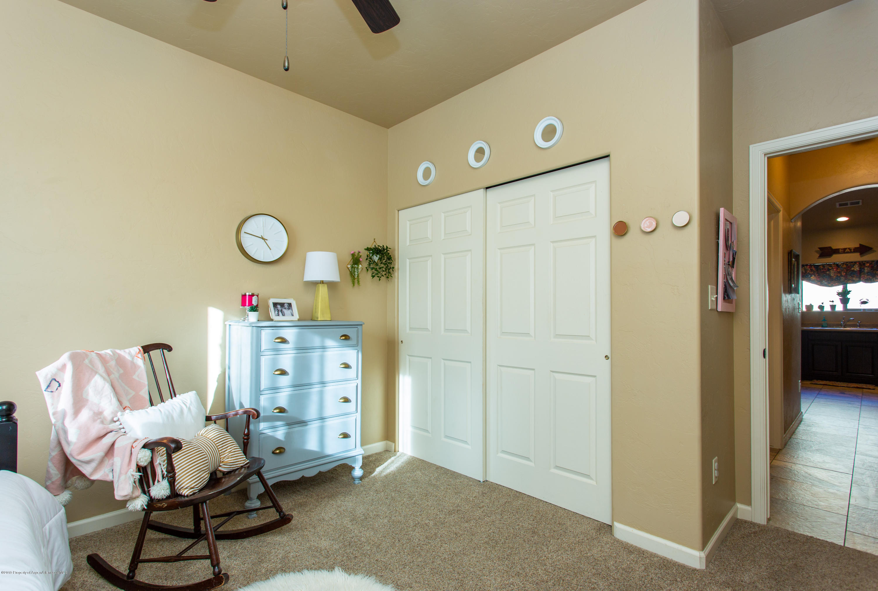 1930 Promontory Circle Rifle, CO 81650 - Photo 13 of 19 a bedroom with furniture and a window