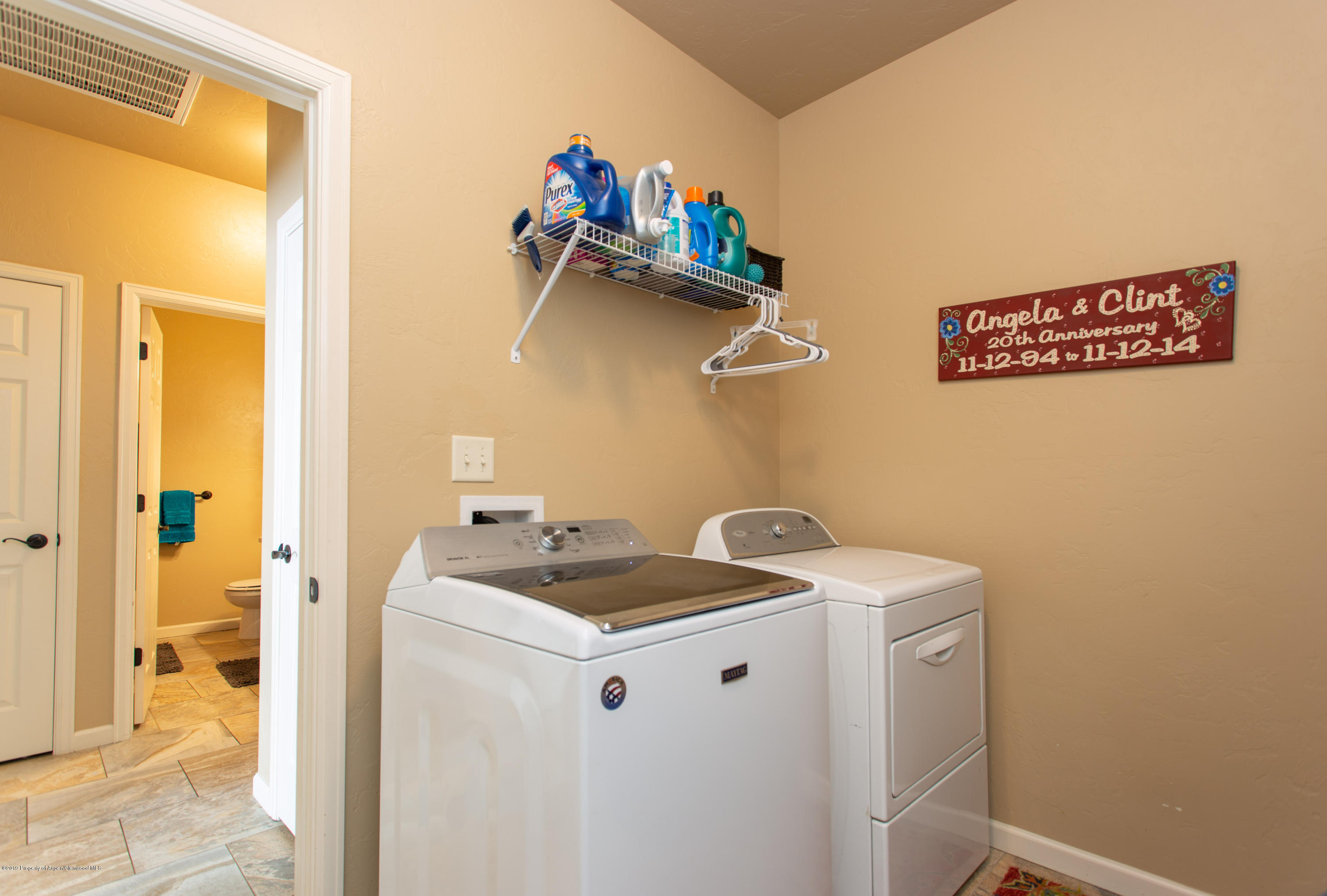 1930 Promontory Circle Rifle, CO 81650 - Photo 17 of 19 a utility room with dryer and washer