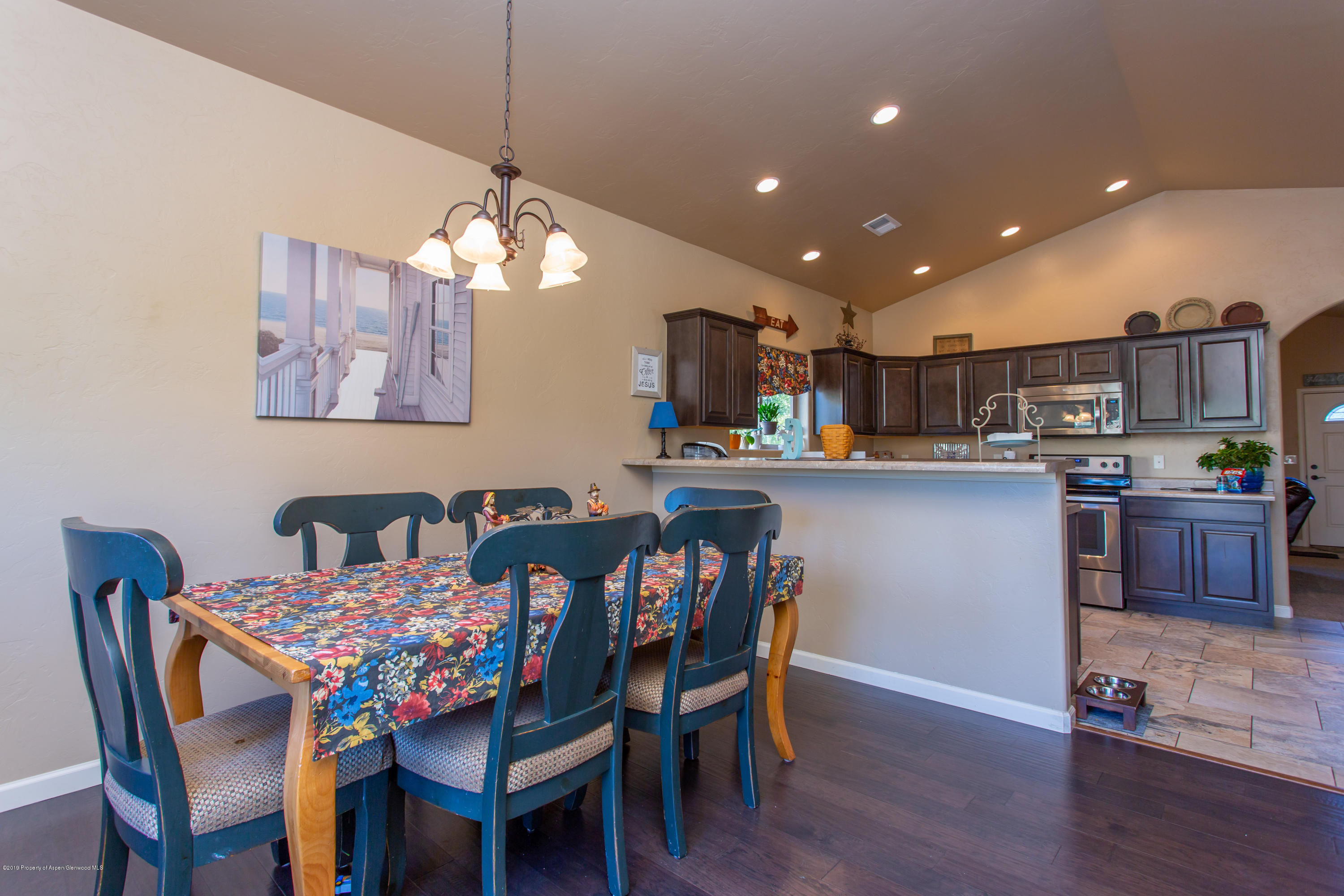 1930 Promontory Circle Rifle, CO 81650 - Photo 6 of 19 a dining room filled chandelier and wooden floor