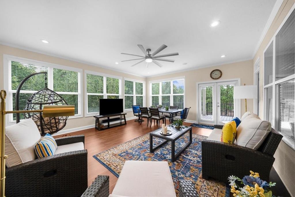 3709 Maple Shade Drive Southwest Gainesville, GA 30504 - Photo 13 of 81 a living room with furniture and a large window with garden view