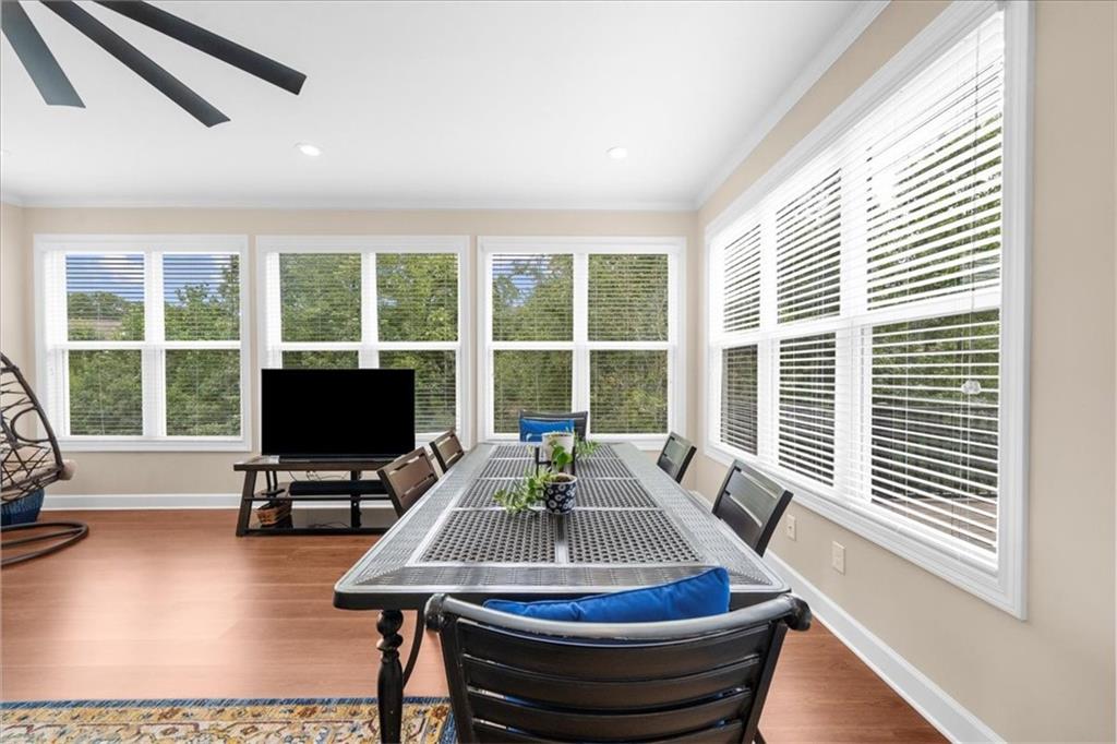 3709 Maple Shade Drive Southwest Gainesville, GA 30504 - Photo 14 of 81 a dining room with wooden floor and a floor to ceiling window