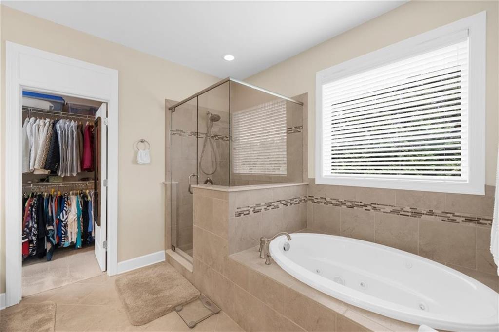 3709 Maple Shade Drive Southwest Gainesville, GA 30504 - Photo 34 of 81 a bathroom with a bathtub and a sink