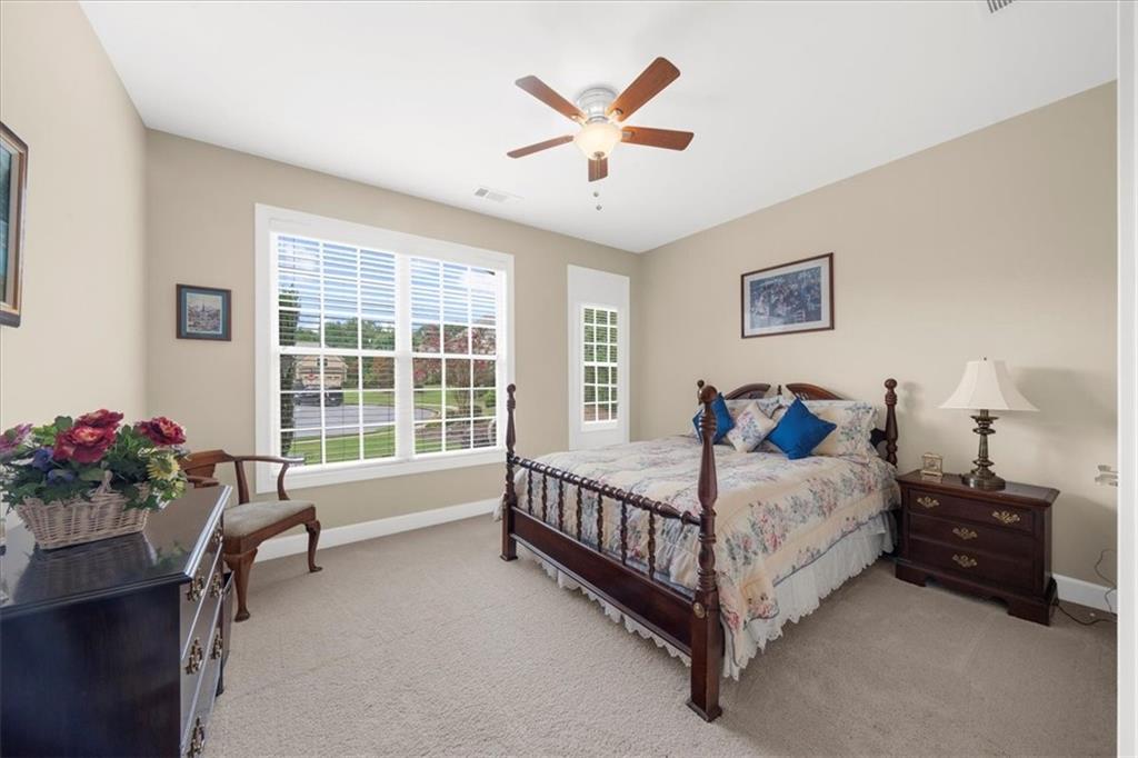 3709 Maple Shade Drive Southwest Gainesville, GA 30504 - Photo 36 of 81 a bed sitting in a bedroom next to a window