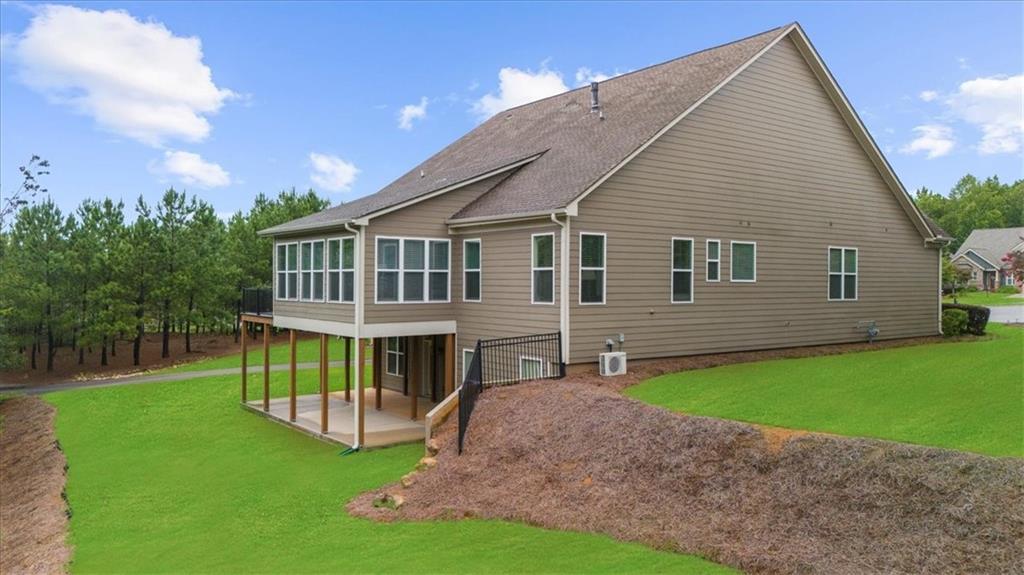 3709 Maple Shade Drive Southwest Gainesville, GA 30504 - Photo 49 of 81 a view of a house with a yard and deck