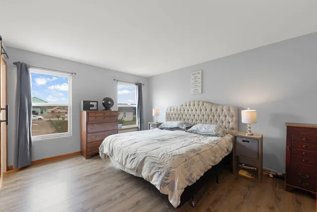 a bedroom with a large bed and a closet