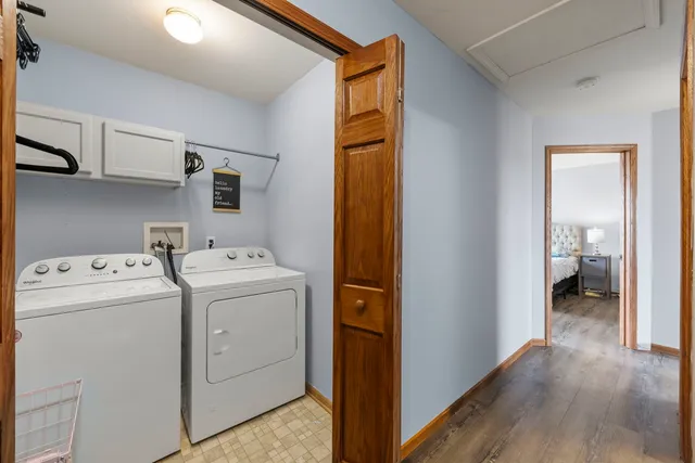 a view of storage and utility room with washer and dryer