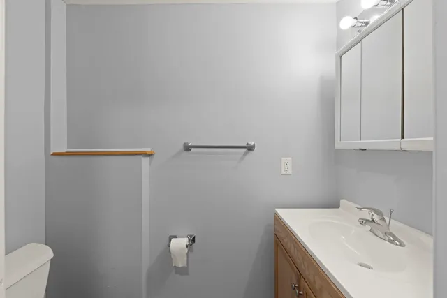 a bathroom with a sink and mirror