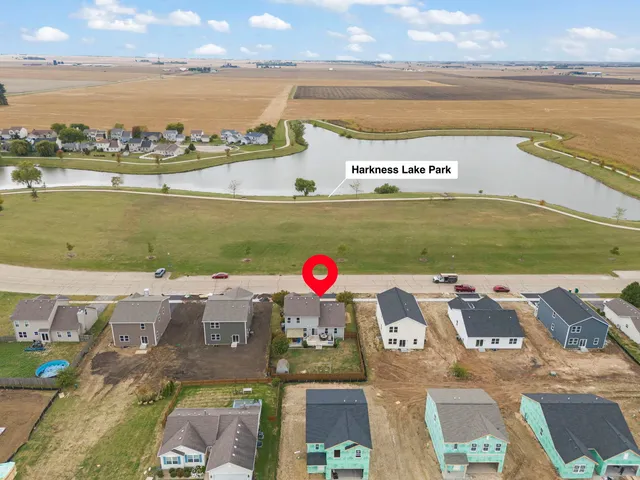 swimming pool with outdoor seating and lake view