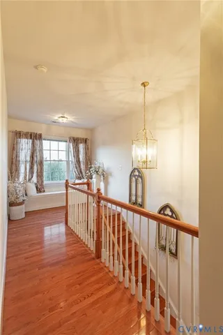 a view of a living room with hardwood floor