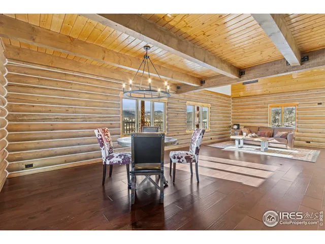 a dining room with furniture and wooden floor