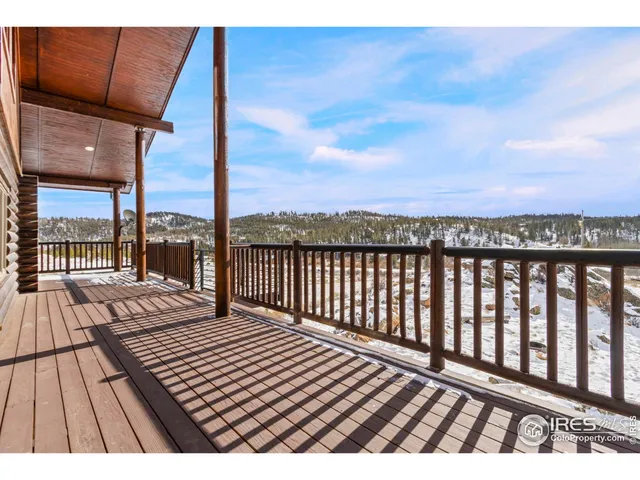 a view of balcony with wooden floor and city view