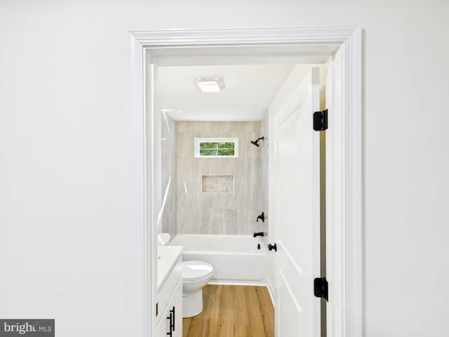 a bathroom with a tub and shower