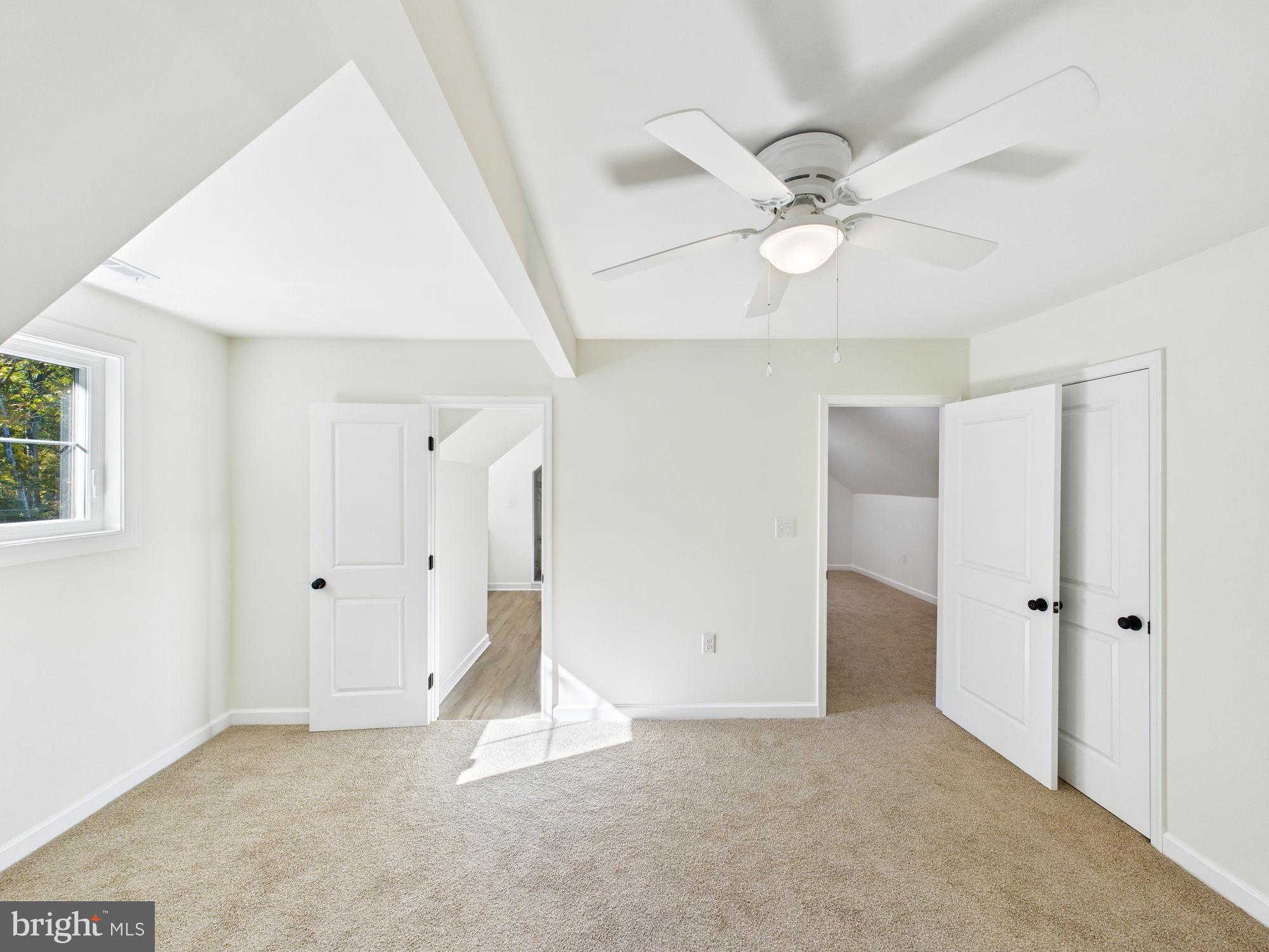 22202 Wetipquin Road Quantico, MD 21856 - Photo 19 of 42 a view of an empty room with a ceiling fan
