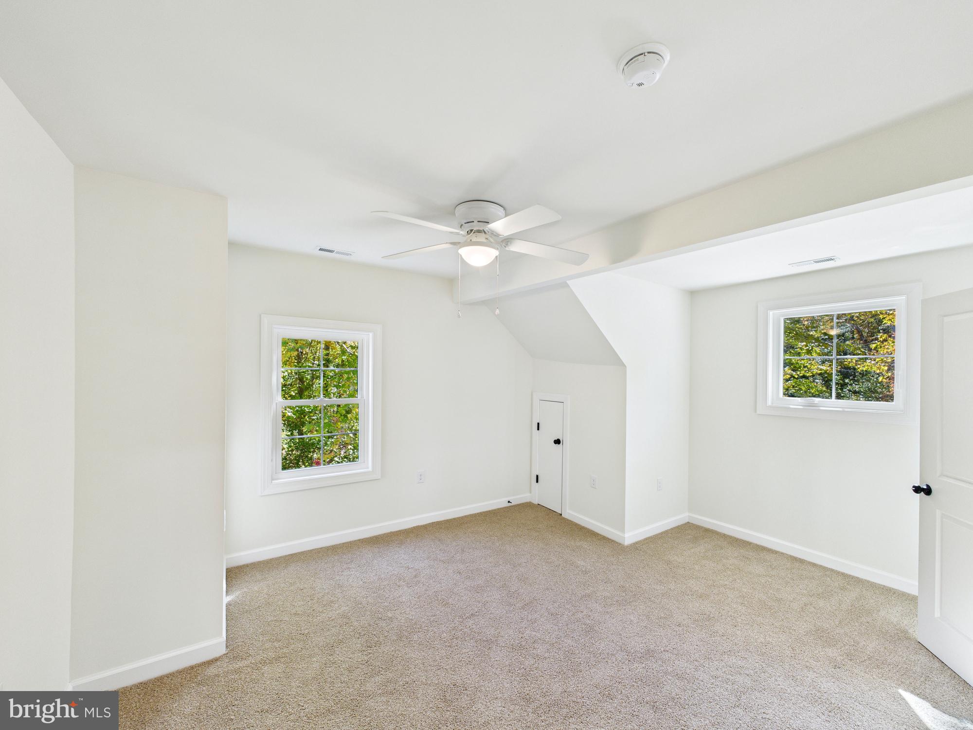22202 Wetipquin Road Quantico, MD 21856 - Photo 21 of 42 an empty room with a window and a fan