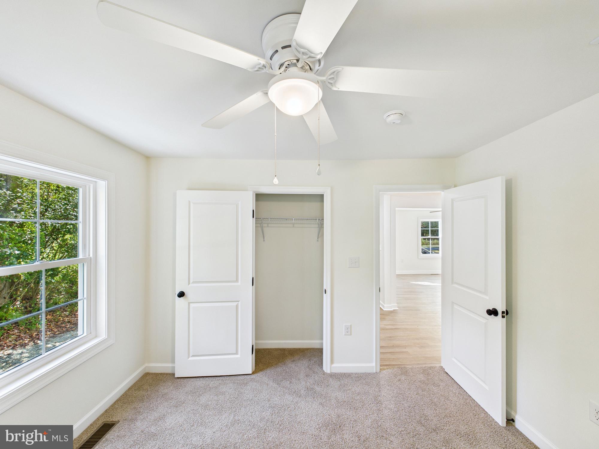 22202 Wetipquin Road Quantico, MD 21856 - Photo 32 of 42 an empty room with windows and entrance