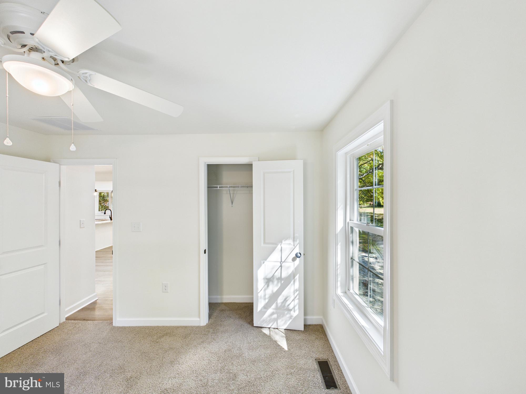 22202 Wetipquin Road Quantico, MD 21856 - Photo 36 of 42 an empty room with windows and closet