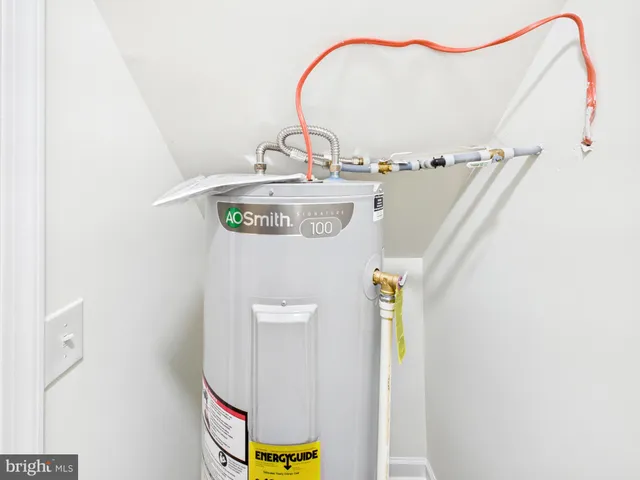 a picture of a bathroom with a sink and mirror