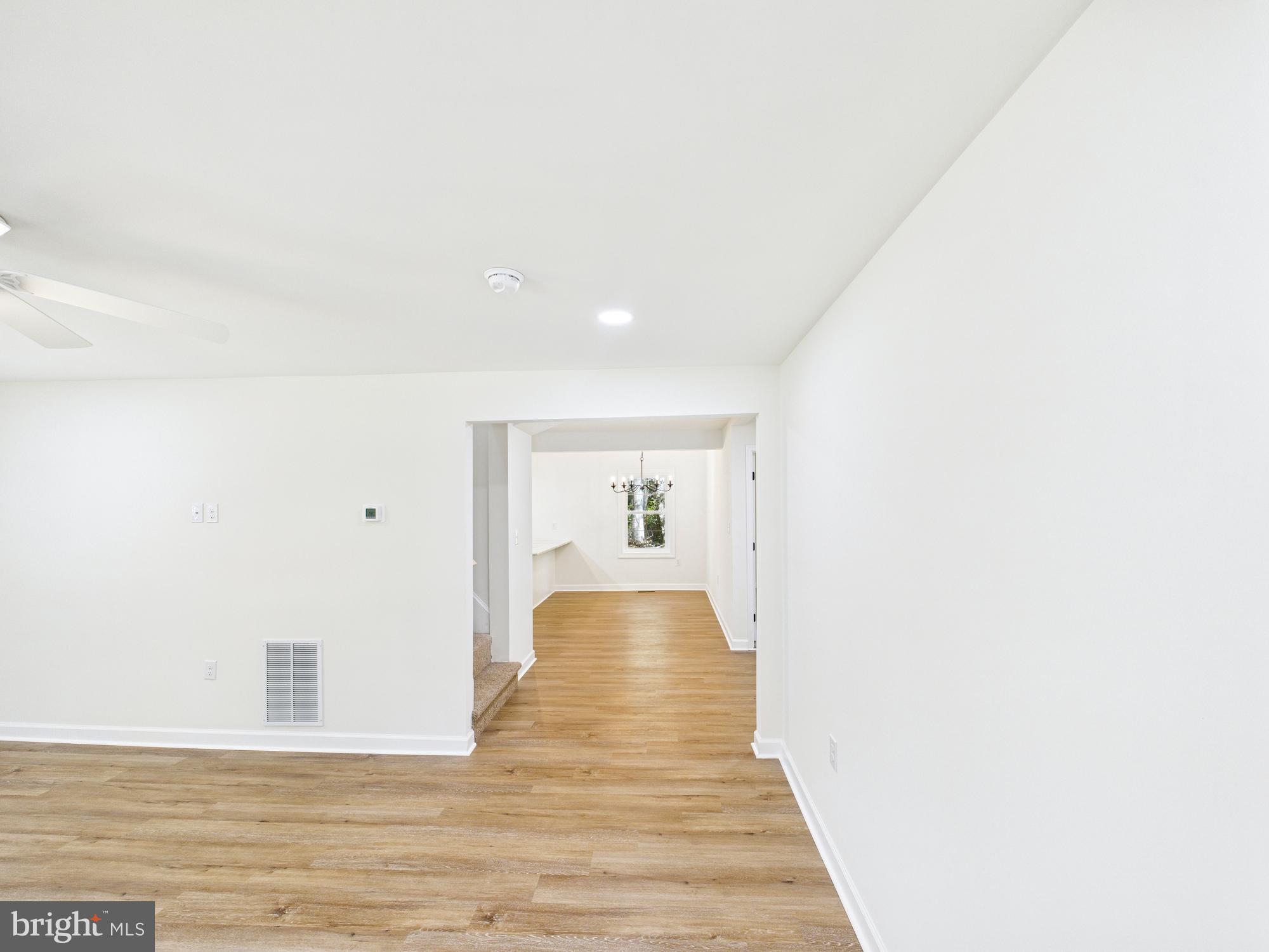 22202 Wetipquin Road Quantico, MD 21856 - Photo 4 of 42 a view of a hallway with wooden floor