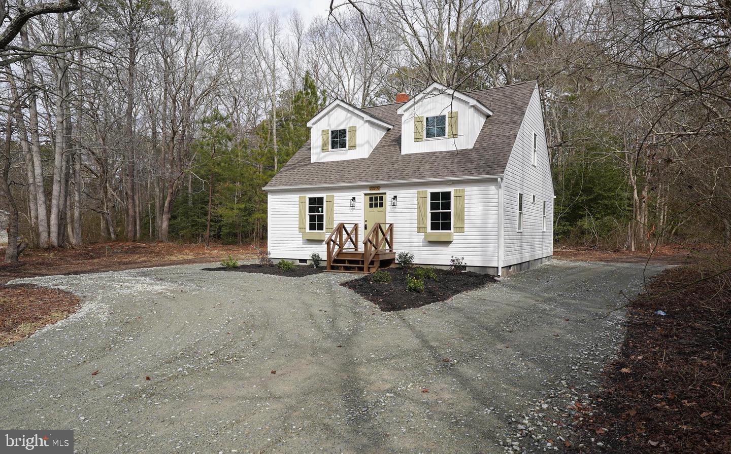 22202 Wetipquin Road Quantico, MD 21856 - Photo 42 of 42 a view of a white house with large trees and outdoor space