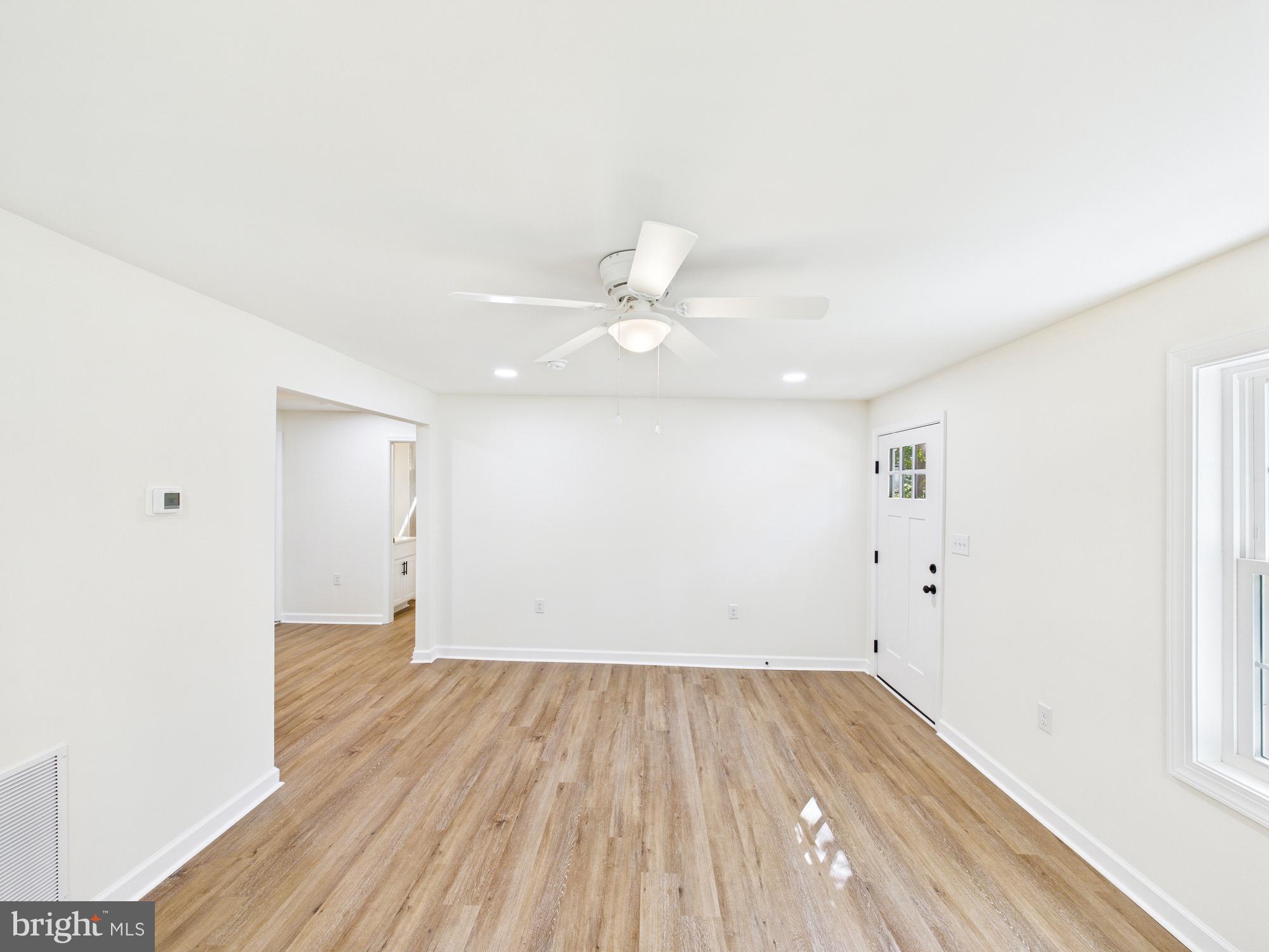 22202 Wetipquin Road Quantico, MD 21856 - Photo 5 of 42 a view of a room with wooden floor and white walls