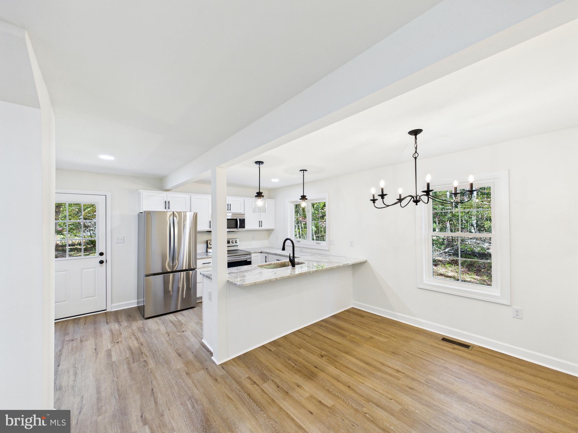 22202 Wetipquin Road Quantico, MD 21856 - Photo 6 of 42 a kitchen with stainless steel appliances a refrigerator and a stove top oven