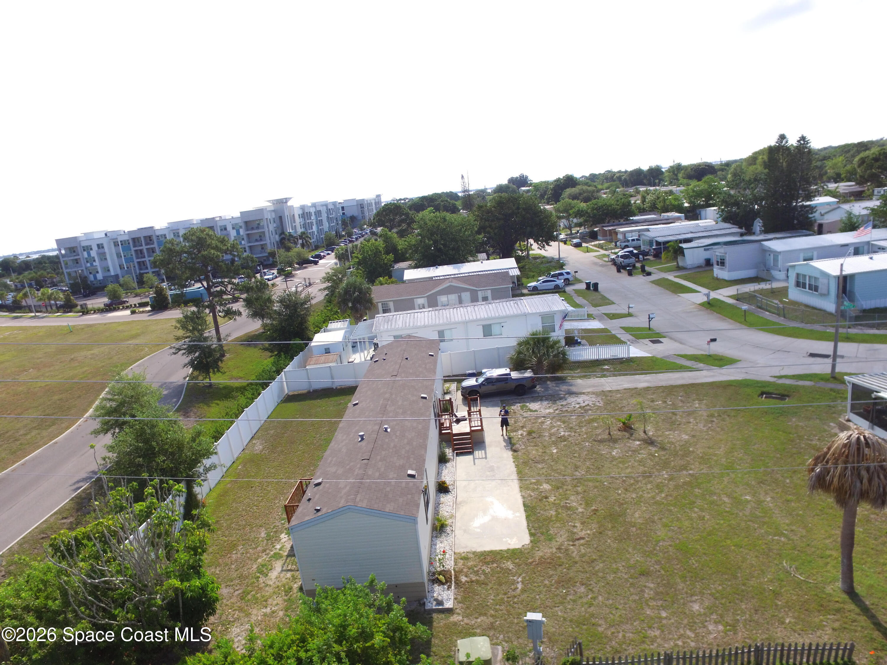 2501 Amberly Road Northeast Palm Bay, FL 32905 - Photo 6 of 25 a view of a lake with a yard