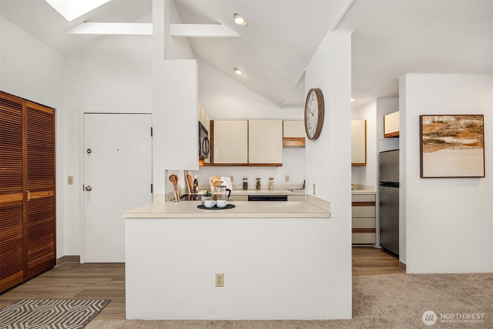 57 Etruria Street, Unit 201 Seattle, WA 98109 - Photo 12 of 26 a bathroom with a sink a toilet and shower