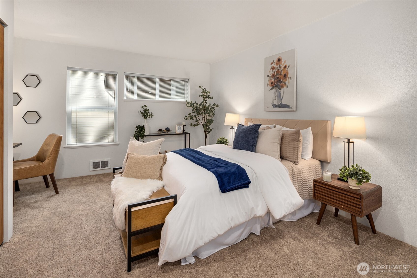 57 Etruria Street, Unit 201 Seattle, WA 98109 - Photo 17 of 26 a bedroom with a bed and a chair