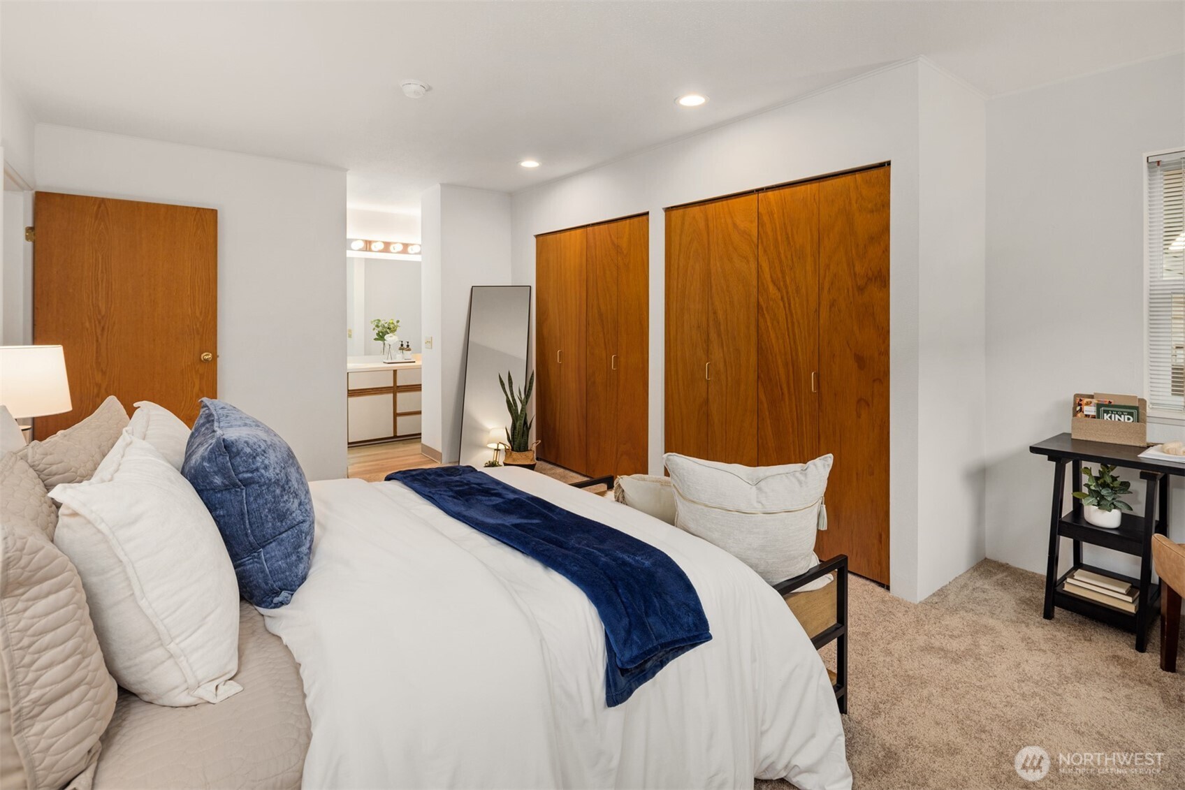 57 Etruria Street, Unit 201 Seattle, WA 98109 - Photo 18 of 26 a bed room with a bed and a chair