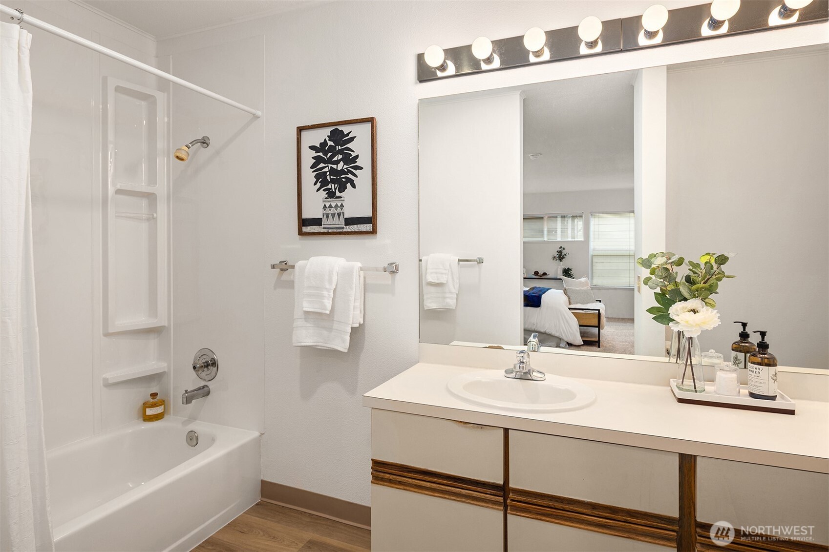 57 Etruria Street, Unit 201 Seattle, WA 98109 - Photo 19 of 26 a bathroom with a sink and a bathtub
