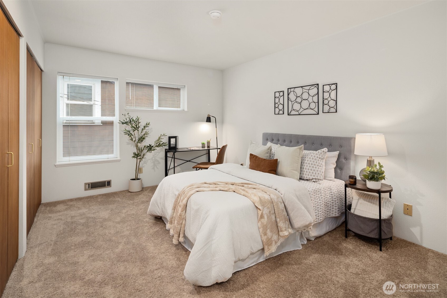 57 Etruria Street, Unit 201 Seattle, WA 98109 - Photo 21 of 26 a bed room with a bed and a chair