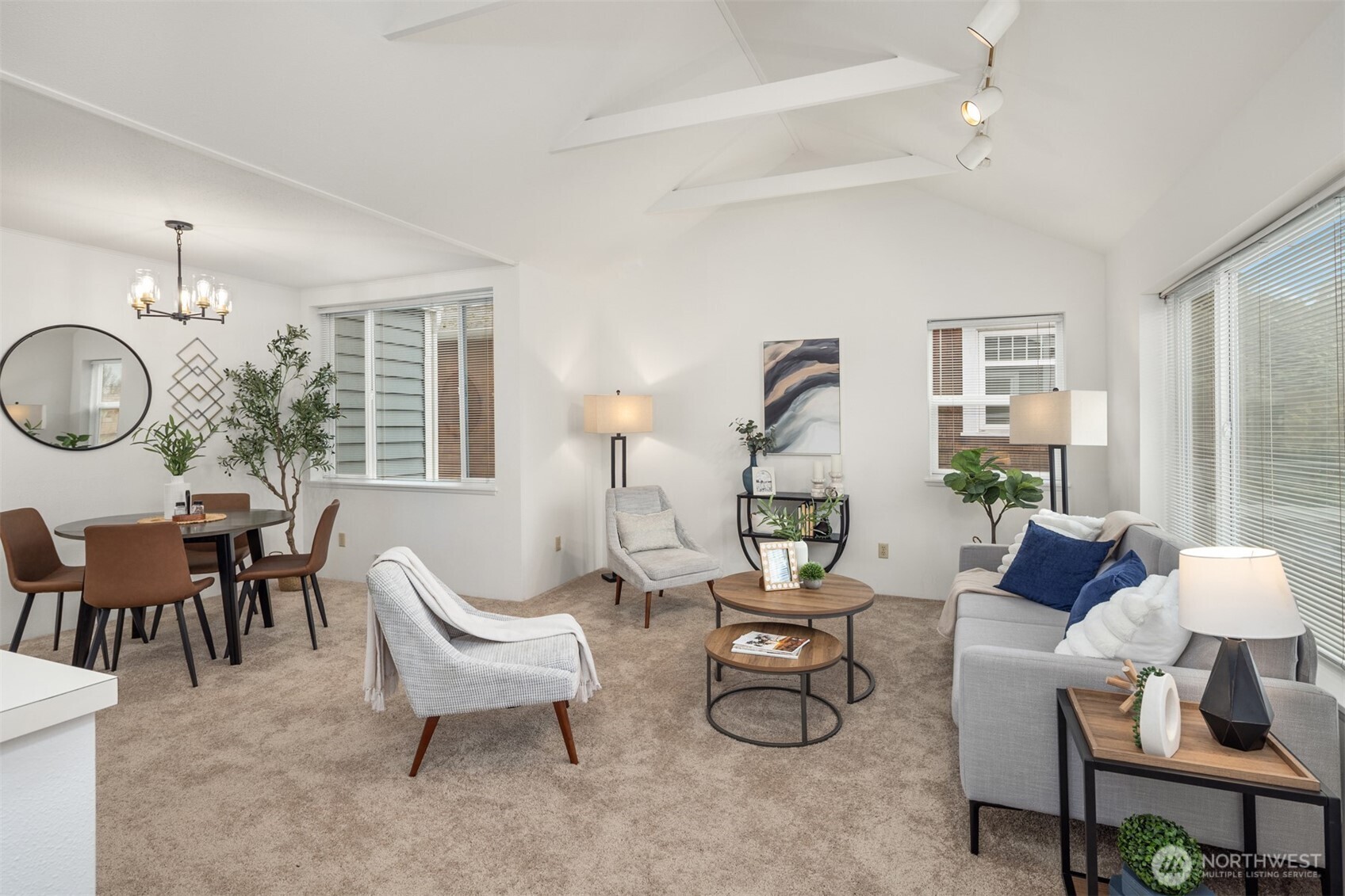 57 Etruria Street, Unit 201 Seattle, WA 98109 - Photo 3 of 26 a living room with furniture a large window and a table