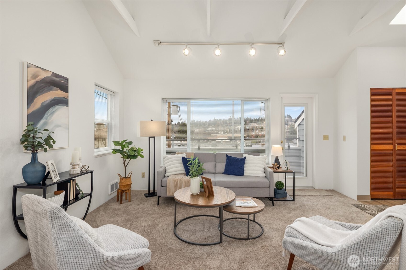 57 Etruria Street, Unit 201 Seattle, WA 98109 - Photo 5 of 26 a living room with furniture and a large window